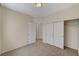 Neutral bedroom featuring sliding closet doors and neutral carpet at 1012 Vanier Ct, Henderson, NV 89052