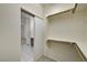 Walk-in closet showing storage space with an open sliding door at 1012 Vanier Ct, Henderson, NV 89052