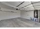 Spacious two-car garage with water heater, door to interior, and storage at 1012 Vanier Ct, Henderson, NV 89052