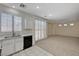 Bright kitchen with stainless steel appliances and large sliding glass doors at 1012 Vanier Ct, Henderson, NV 89052