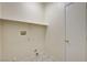 Small laundry room with tile floor and built-in shelf at 1012 Vanier Ct, Henderson, NV 89052