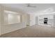 Inviting living area providing seamless flow to the kitchen, with lots of light and updated flooring and modern paint at 1012 Vanier Ct, Henderson, NV 89052