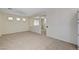 Spacious living room with neutral carpet, bright windows, and open floor plan at 1012 Vanier Ct, Henderson, NV 89052