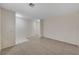 Spacious carpeted living room with bright neutral walls, ready for your personal touch and customization at 1012 Vanier Ct, Henderson, NV 89052