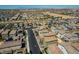 An expansive aerial neighborhood view showing many similar houses and a distant city skyline at 10352 Rye Patch Creek St, Las Vegas, NV 89141