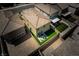 An aerial view displays the backyard featuring artificial grass, a patio area and contemporary landscape design at 10352 Rye Patch Creek St, Las Vegas, NV 89141
