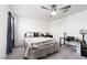 This modern bedroom has a ceiling fan, and a black desk at 10352 Rye Patch Creek St, Las Vegas, NV 89141