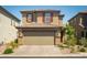 Two-story home with an attached two car garage at 10352 Rye Patch Creek St, Las Vegas, NV 89141