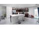 Bright kitchen with white countertops, dark cabinetry, stainless steel appliances, and an adjacent dining area at 10352 Rye Patch Creek St, Las Vegas, NV 89141