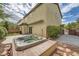 Backyard with a hot tub, patio, and manicured landscaping providing a serene outdoor experience at 10513 Bandera Mountain Ln, Las Vegas, NV 89166