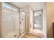 Walk-in shower with glass door and natural light at 10513 Bandera Mountain Ln, Las Vegas, NV 89166