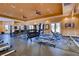 A fully-equipped fitness center boasts treadmills, weights, and mirrored walls for a complete workout experience at 10513 Bandera Mountain Ln, Las Vegas, NV 89166