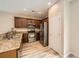 Well-equipped kitchen featuring stainless steel appliances, granite countertops, and wood cabinets at 10513 Bandera Mountain Ln, Las Vegas, NV 89166