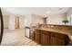 Spacious kitchen featuring stainless steel appliances, granite countertops, wood cabinets, and an open concept design at 10513 Bandera Mountain Ln, Las Vegas, NV 89166