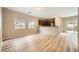 Bright, open-concept living area with hardwood floors, large windows, and seamless transition to the kitchen at 10513 Bandera Mountain Ln, Las Vegas, NV 89166