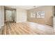 Inviting living area with wood floors, bright windows, and a welcoming atmosphere at 10513 Bandera Mountain Ln, Las Vegas, NV 89166