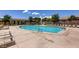 A spacious pool area with comfortable lounge chairs and scenic views, ideal for sunny days at 10513 Bandera Mountain Ln, Las Vegas, NV 89166