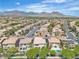 Expansive aerial view of a well-planned community in Las Vegas with stunning mountain views at 10613 Turquoise Valley Dr, Las Vegas, NV 89144