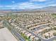 Extensive desert community featuring uniform architecture, landscaping, and mountain backdrop at 10613 Turquoise Valley Dr, Las Vegas, NV 89144