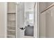 View of modern bathroom from walk-in closet showing tub and glass shower at 10613 Turquoise Valley Dr, Las Vegas, NV 89144