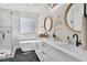 Elegant bathroom with double sinks, soaking tub, and separate glass-enclosed shower at 10613 Turquoise Valley Dr, Las Vegas, NV 89144