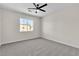 Bedroom with plush carpet, ceiling fan, and window at 10613 Turquoise Valley Dr, Las Vegas, NV 89144