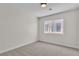 Neutral bedroom with plush carpet and a bright window at 10613 Turquoise Valley Dr, Las Vegas, NV 89144