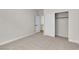 Simple bedroom with carpet flooring and open closet at 10613 Turquoise Valley Dr, Las Vegas, NV 89144