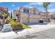 Two-story home with a two-car garage, a well-kept lawn, and mature landscaping at 10613 Turquoise Valley Dr, Las Vegas, NV 89144