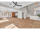 Bright living room showing the stairs, kitchen, and an open floor plan at 10613 Turquoise Valley Dr, Las Vegas, NV 89144