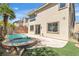 Inviting backyard with a sparkling pool and spa, perfect for outdoor entertaining and relaxation on a sunny day at 10613 Turquoise Valley Dr, Las Vegas, NV 89144