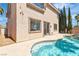 Stunning backyard with a refreshing pool and spa, ideal for enjoying warm weather and outdoor living at 10613 Turquoise Valley Dr, Las Vegas, NV 89144