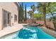 Lush backyard with a sparkling pool and spa, perfect for relaxation and enjoying the outdoor living space at 10613 Turquoise Valley Dr, Las Vegas, NV 89144