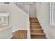 Elegant staircase with wood treads, white risers, and contemporary design at 10613 Turquoise Valley Dr, Las Vegas, NV 89144