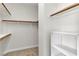 Spacious walk-in closet with multiple shelves and hanging rods provides ample storage at 10613 Turquoise Valley Dr, Las Vegas, NV 89144