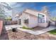 Backyard featuring large concrete patio, xeriscaping, and mature trees at 110 Wynntry Dr, Henderson, NV 89074