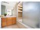 Cozy bathroom offering tile surround, a modern vanity, and glass shower doors at 110 Wynntry Dr, Henderson, NV 89074
