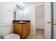 Bathroom features a modern vanity, granite countertop, tile floor, and a walk-in closet at 110 Wynntry Dr, Henderson, NV 89074