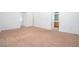Bedroom featuring neutral carpet and an en-suite bathroom entrance at 110 Wynntry Dr, Henderson, NV 89074