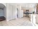 Cozy kitchen with white appliances, tile floors, and access to dining and living areas at 110 Wynntry Dr, Henderson, NV 89074
