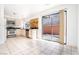 Bright kitchen features tile flooring, ample cabinet space, and a sliding door to the backyard at 110 Wynntry Dr, Henderson, NV 89074
