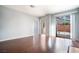Spacious living room showcases sleek hardwood floors, archways, and slider door access to backyard at 110 Wynntry Dr, Henderson, NV 89074