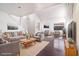 Bright living room with vaulted ceilings, hardwood floors, and neutral decor at 110 Wynntry Dr, Henderson, NV 89074