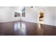Bright living room with dark wood floors, arched doorway, and lots of natural light at 110 Wynntry Dr, Henderson, NV 89074