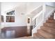 Open living room with hardwood floors, staircase and lots of natural light at 110 Wynntry Dr, Henderson, NV 89074