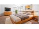 Cozy main bedroom with neutral decor, a mounted TV, and ample natural light at 110 Wynntry Dr, Henderson, NV 89074