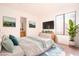 Bright main bedroom featuring a calming color palette, a dresser, and a large window at 110 Wynntry Dr, Henderson, NV 89074