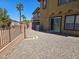 Desert landscaped backyard with gravel, mature trees, and private access to the adjacent green space at 1169 Paradise River Rd, Henderson, NV 89002