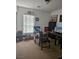 Bedroom boasts carpet, a bright window, and ample storage space, perfect for relaxation or productivity at 1169 Paradise River Rd, Henderson, NV 89002