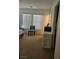 Cozy bedroom with two windows providing natural light, featuring chair and closet at 1169 Paradise River Rd, Henderson, NV 89002
